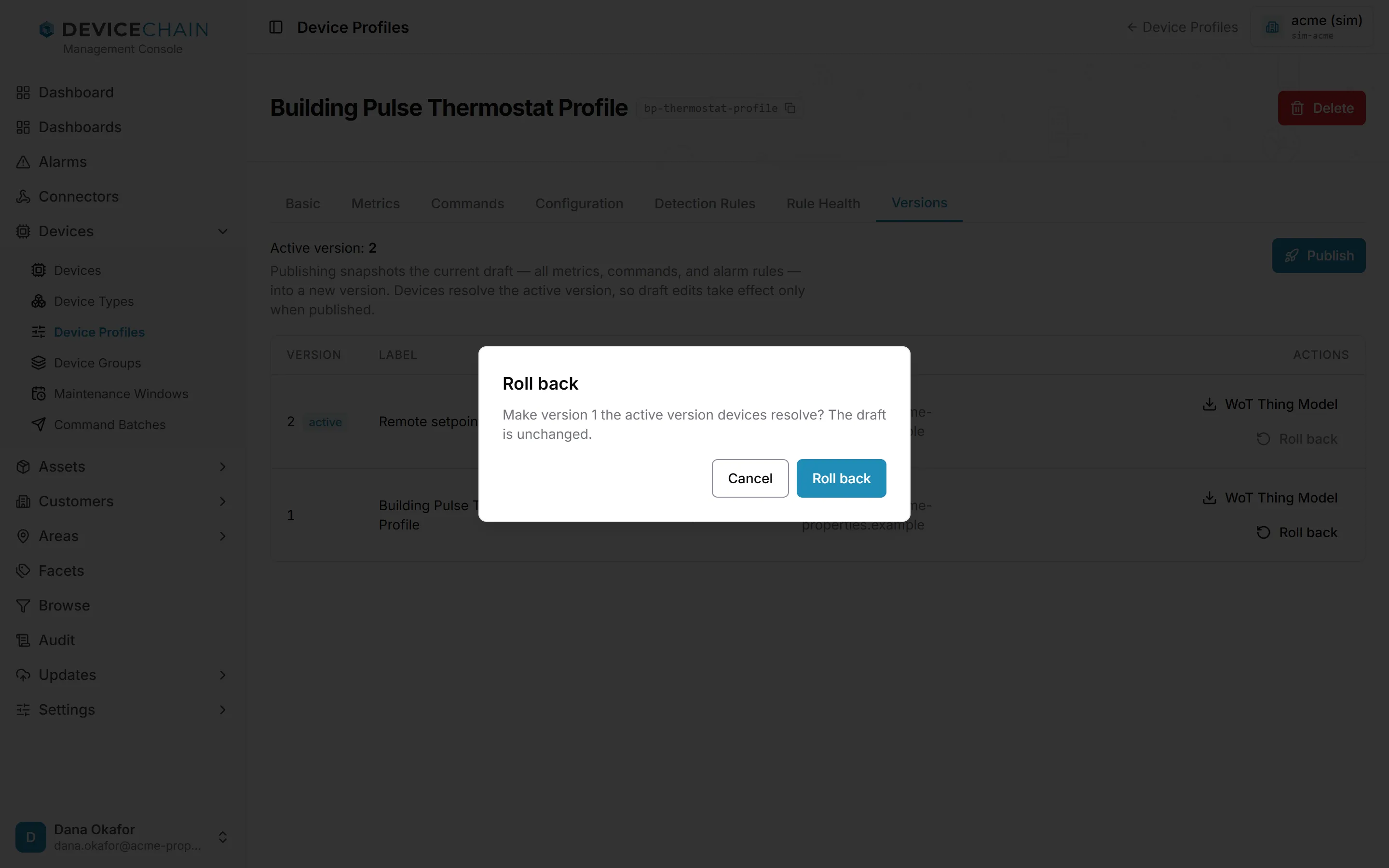 A confirmation dialog titled 'Roll back' over the Versions tab. It reads 'Make version 1 the active version devices resolve? The draft is unchanged.' with Cancel and Roll back buttons.