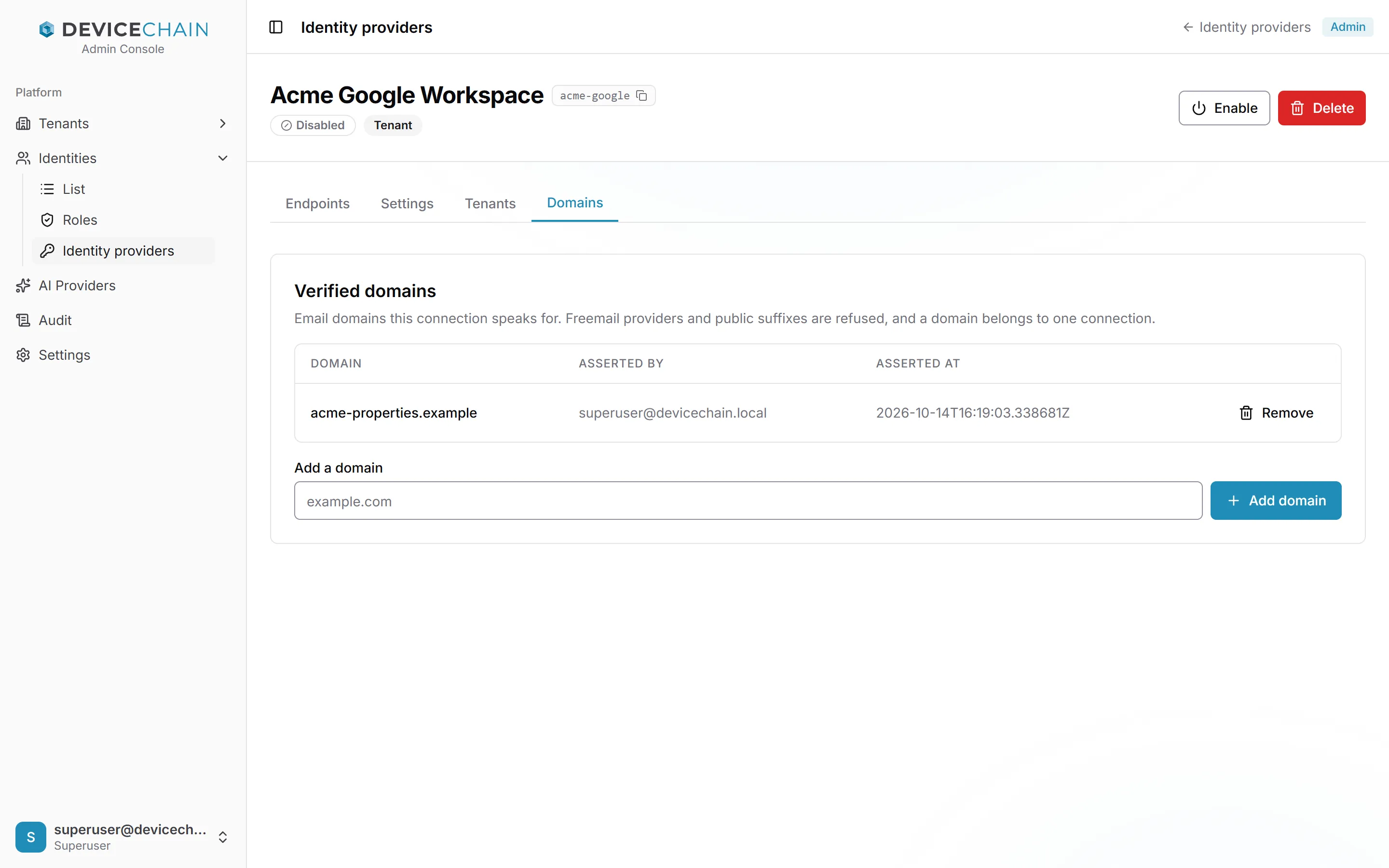 Acme Google Workspace 的 Domains 选项卡。在 Verified domains 下有一行：acme-properties.example，由 superuser@devicechain.local 声明并附时间戳，以及 Remove 按钮。下方是 Add a domain 字段（占位符 example.com）和“Add domain”按钮。